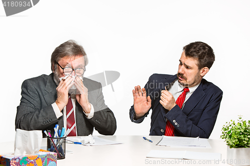 Image of The two colleagues working together at office on white background.