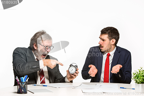 Image of The two colleagues working together at office on white background.