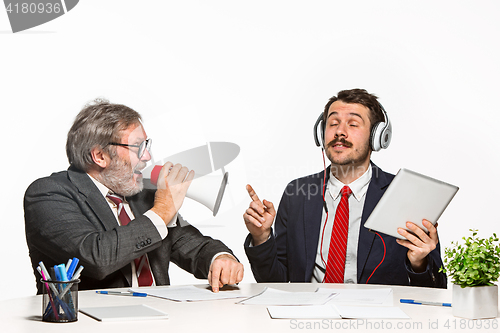 Image of The two colleagues working together at office on white background.