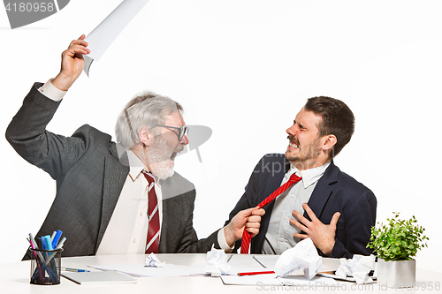 Image of The two colleagues working together at office on white background.