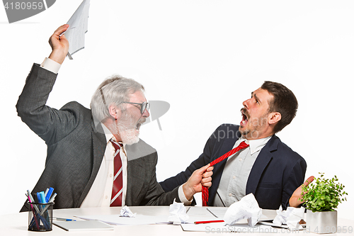 Image of The two colleagues working together at office on white background.