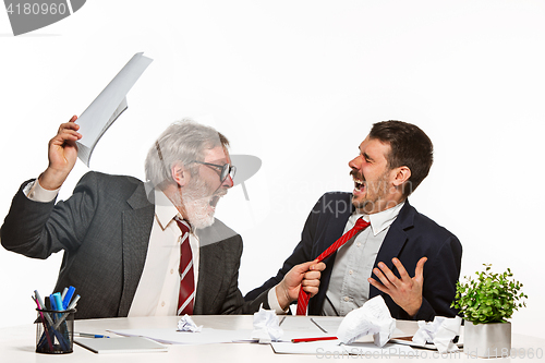 Image of The two colleagues working together at office on white background.