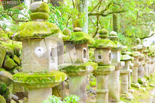 Image of Old stone lanterns in Nara. Selective focus.