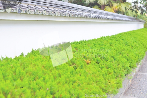 Image of Old white plastered japanese wall in Kyoto. Selective focus.