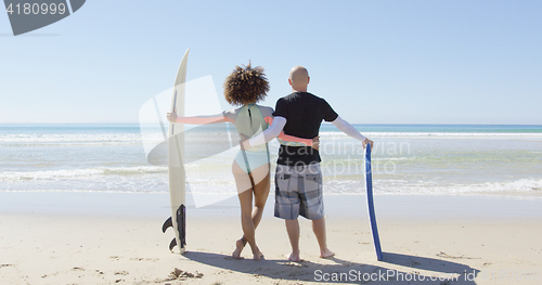 Image of A couple embracing on shore