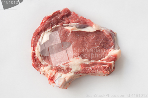 Image of A piece of beef with bone on a white background