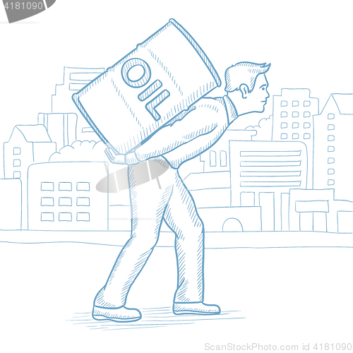 Image of Man carrying an oil barrel on his back.