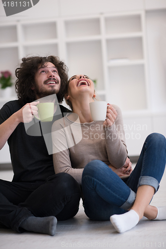 Image of young couple in their new home