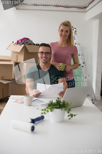 Image of Young couple moving in a new home