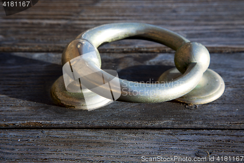 Image of knocker abstract doorin the brown spain