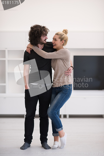 Image of couple hugging in their new home