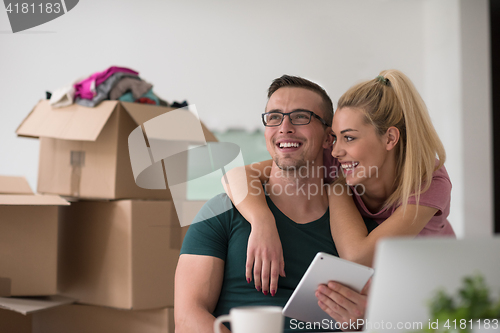 Image of Young couple moving in a new home