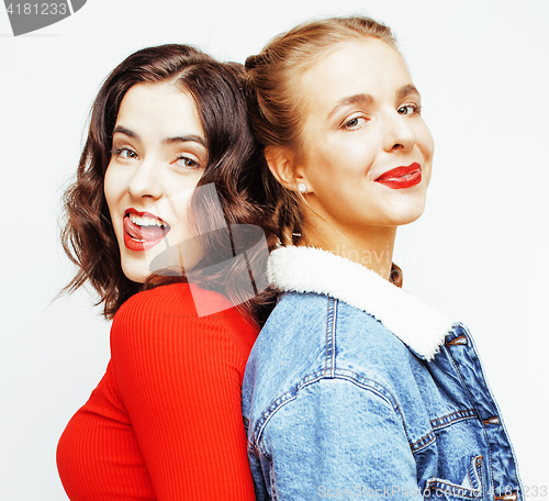 Image of lifestyle people concept: two pretty stylish modern hipster teen girl having fun together, happy smiling making selfie