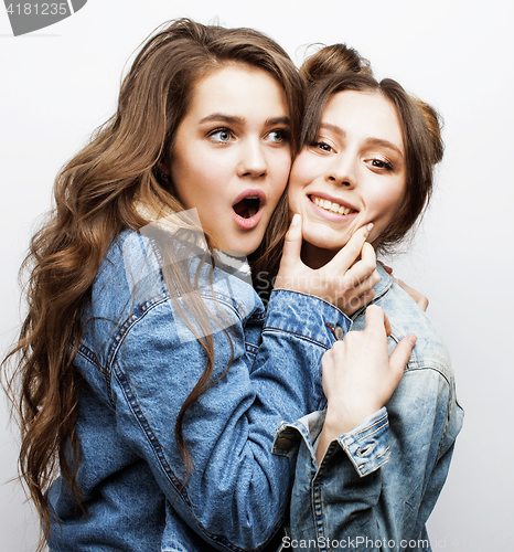 Image of lifestyle people concept: two pretty stylish modern hipster teen girl having fun together, happy smiling making selfie