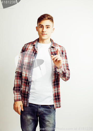 Image of young handsome teenage hipster guy posing emotional, happy smiling against white background isolated, lifestyle people concept