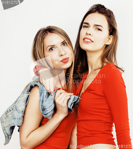 Image of lifestyle people concept: two pretty stylish modern hipster teen girl having fun together, happy smiling making selfie