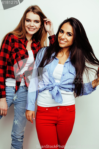 Image of best friends teenage girls together having fun, posing emotional on white background, besties happy smiling, lifestyle people concept, blond and brunette multi nations 