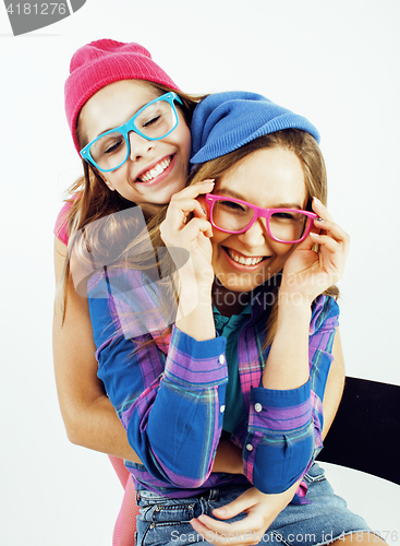 Image of lifestyle people concept: two pretty stylish modern hipster teen girl having fun together, happy smiling making selfie