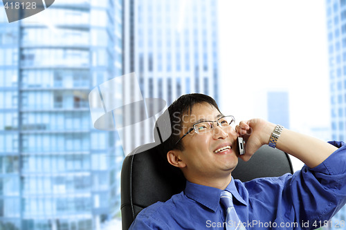 Image of Asian businessman on the phone