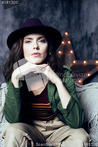 Image of young pretty woman waiting alone in modern loft studio, fashion musician concept, lifestyle people