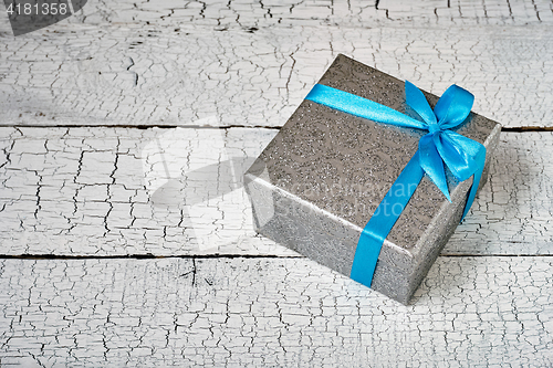 Image of Gift box with blue ribbon