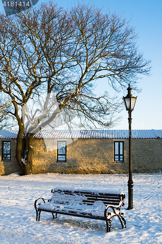 Image of Bench and street lamp in the park, winter