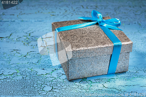 Image of Gift box with blue ribbon