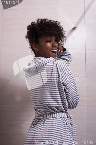 Image of beautiful black woman wearing  bathrobe