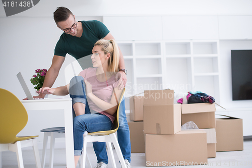 Image of Young couple moving in a new home