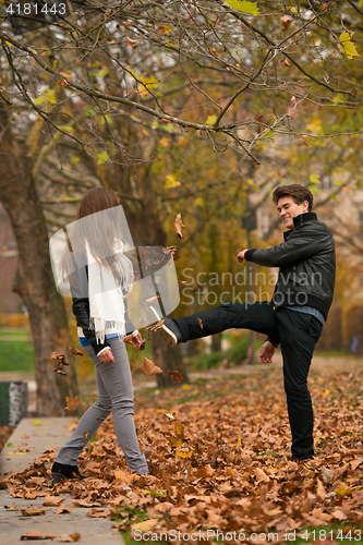 Image of Happy young Couple in Autumn Park