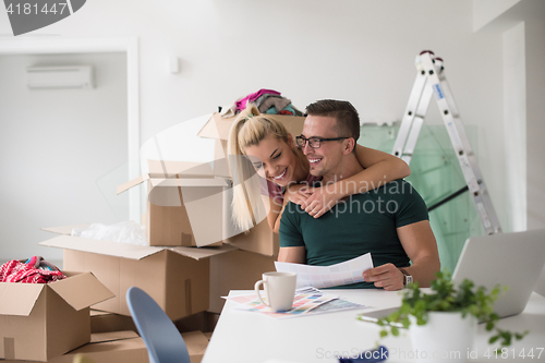 Image of Young couple moving in a new home