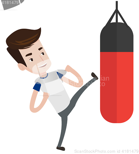 Image of Man exercising with punching bag.