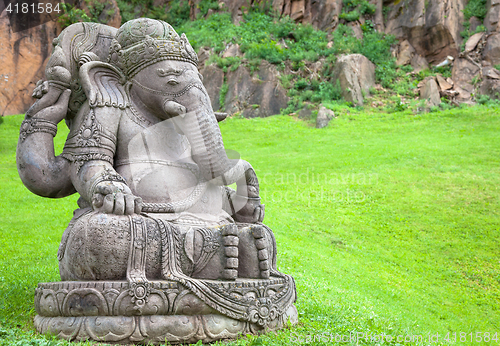 Image of Ganesha statue in a beautiful mountain garden