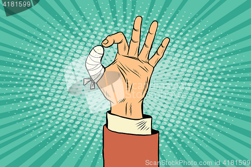 Image of OK gesture bandaged finger