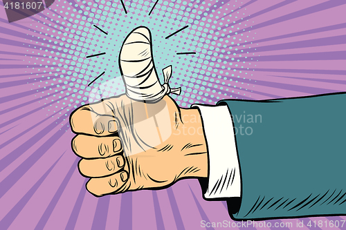 Image of Bandaged finger up, like approval gesture