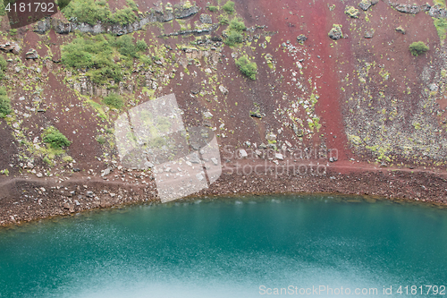 Image of Kerid is a crater lake of a turquoise color - Iceland