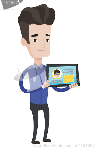 Image of Man holding tablet with social network.