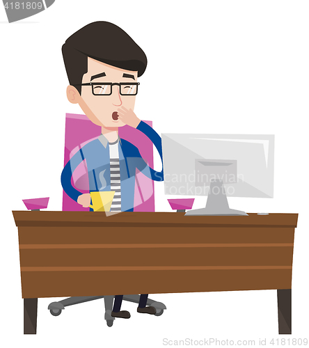 Image of Tired employee working in office.