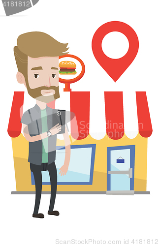 Image of Man looking for restaurant in his smartphone.