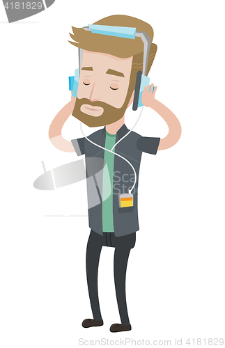 Image of Young man in headphones listening to music.