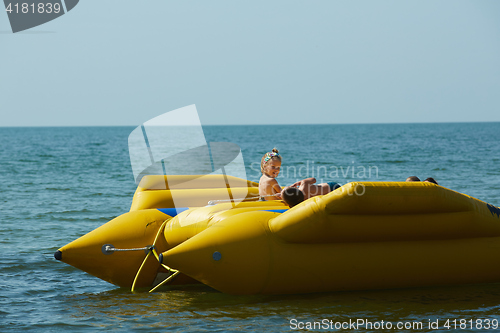 Image of two happy kids playing on the boat at summer day
