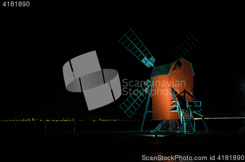 Image of Illuminated old wooden windmill