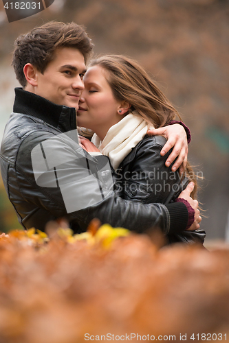 Image of Autumn portrait of attractive happy couple