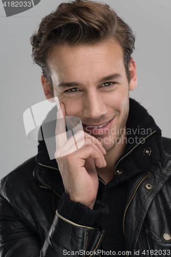 Image of portrait of a young guy over gray background