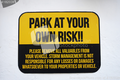 Image of Park at your own risk sign