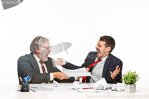 Image of The two colleagues working together at office on white background.