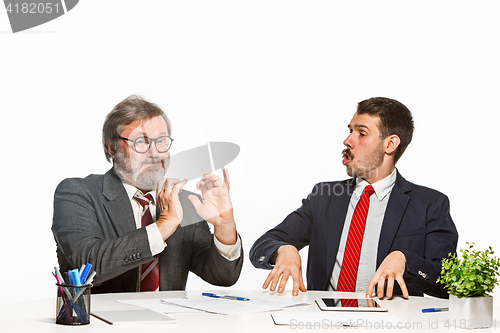 Image of The two colleagues working together at office on white background.