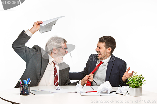 Image of The two colleagues working together at office on white background.