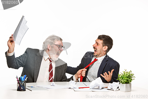 Image of The two colleagues working together at office on white background.