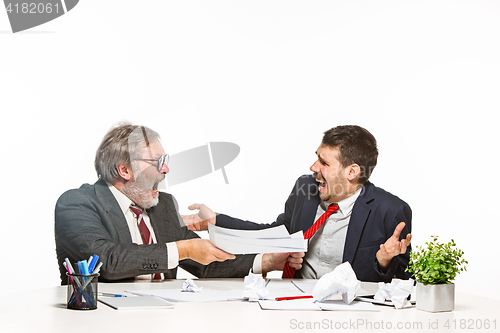 Image of The two colleagues working together at office on white background.